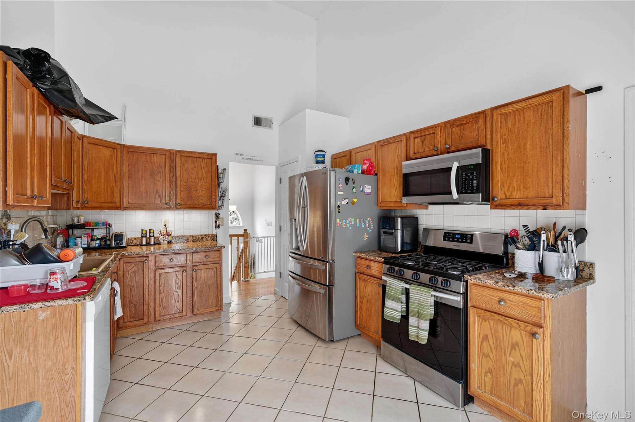2 Berkeley Court Highland Mills, NY 10930 - Photo 14 of 44 a kitchen with a sink a stove and refrigerator