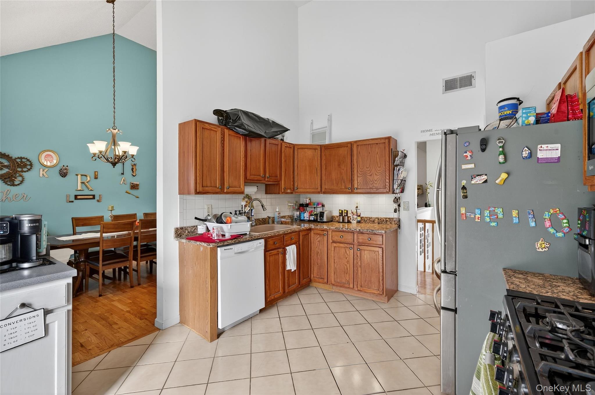 2 Berkeley Court Highland Mills, NY 10930 - Photo 15 of 44 a kitchen with stainless steel appliances granite countertop a refrigerator and a stove top oven