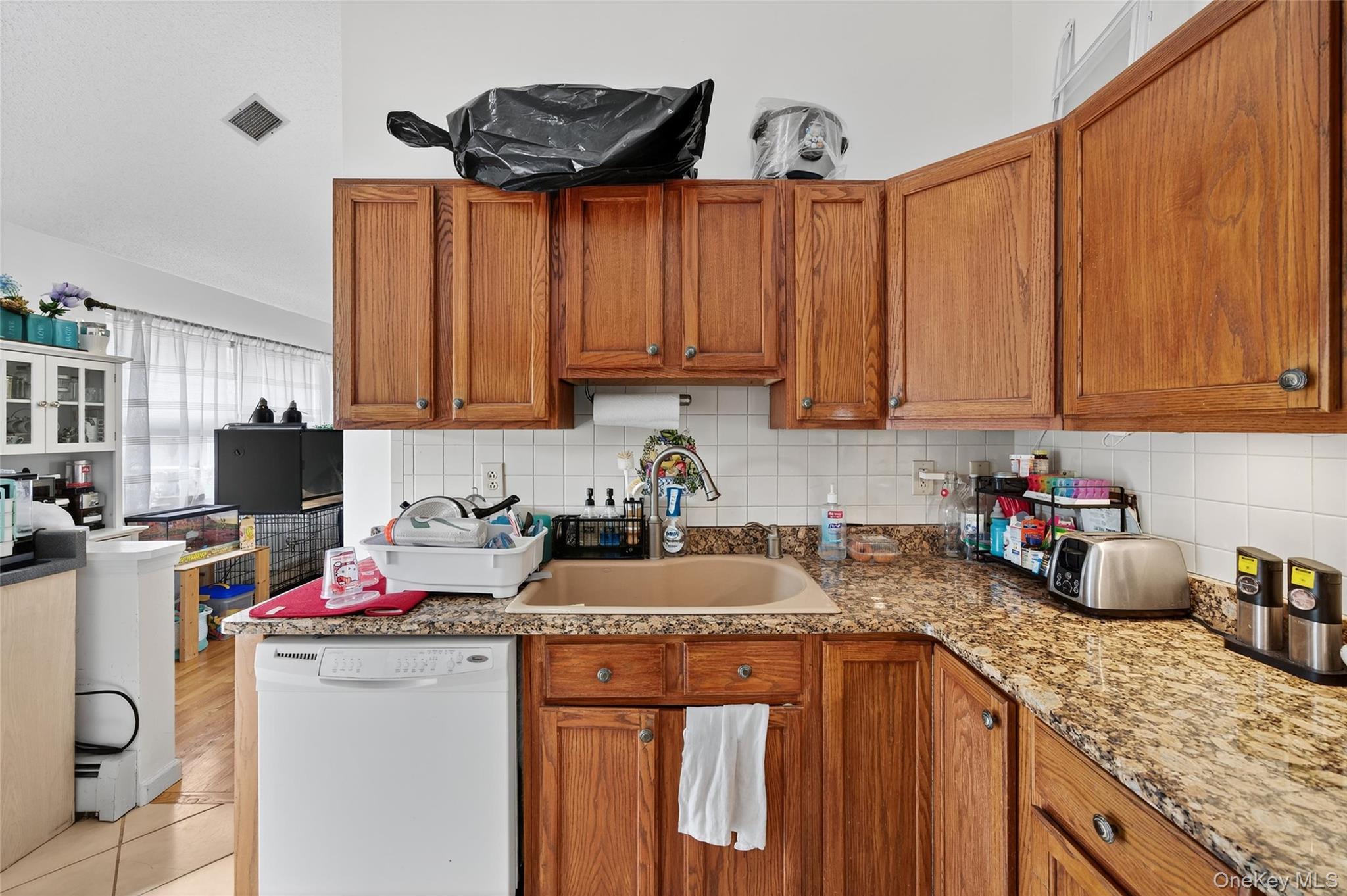 2 Berkeley Court Highland Mills, NY 10930 - Photo 16 of 44 a kitchen with a sink a stove and cabinets