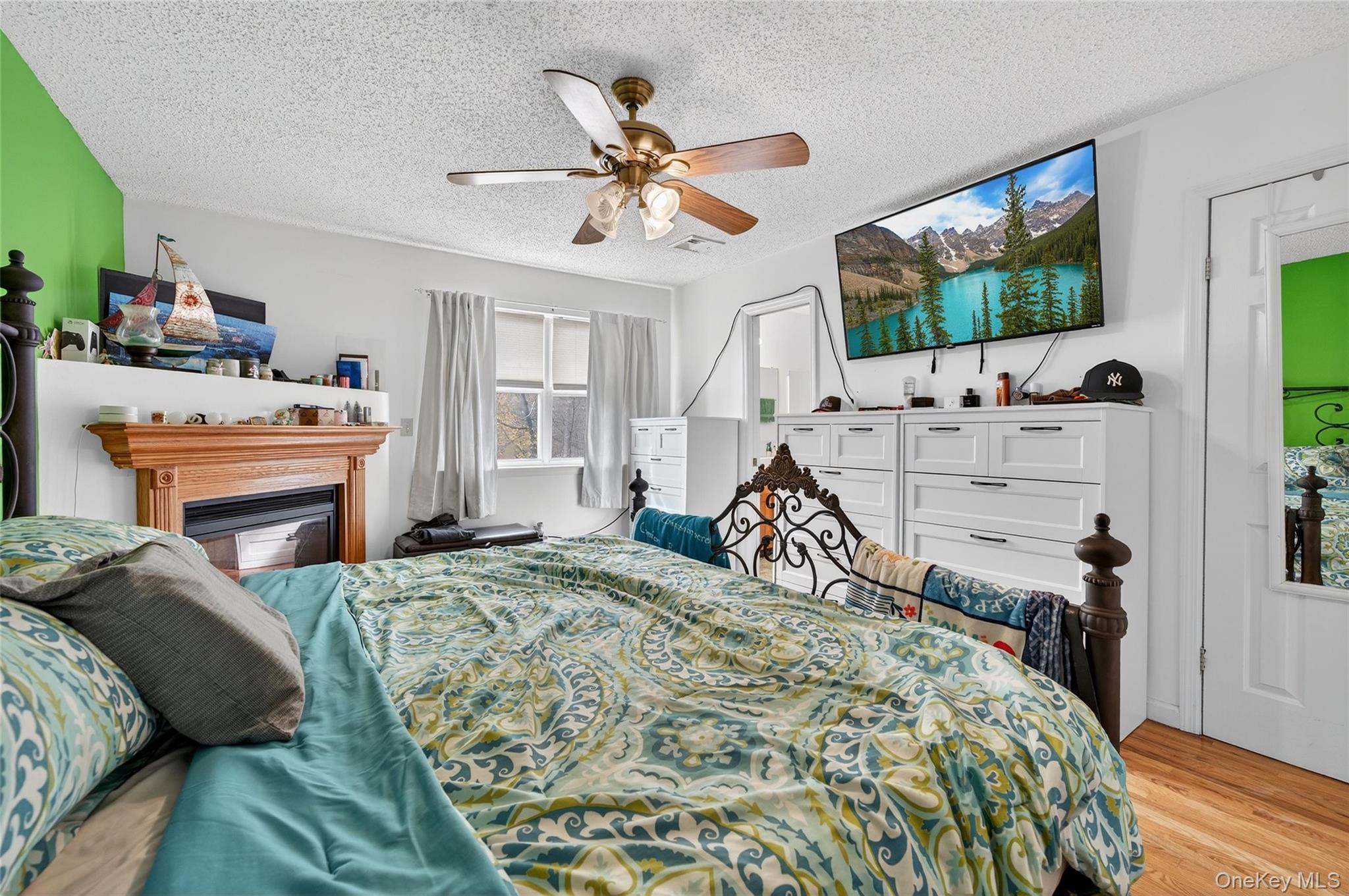 2 Berkeley Court Highland Mills, NY 10930 - Photo 20 of 44 a bedroom with a bed and a flat screen tv