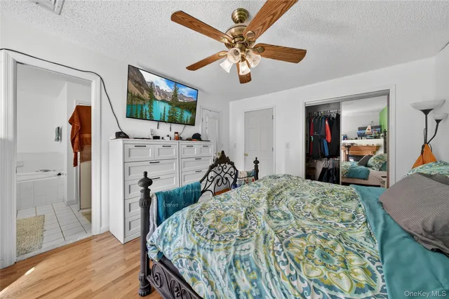 a view of a livingroom with furniture and a flat screen tv