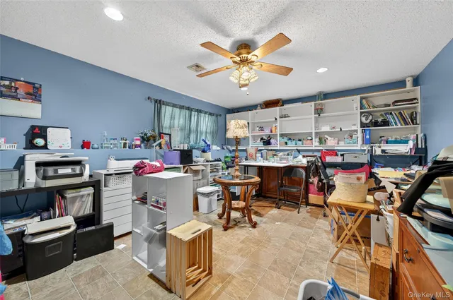 a room with furniture and a flat screen tv
