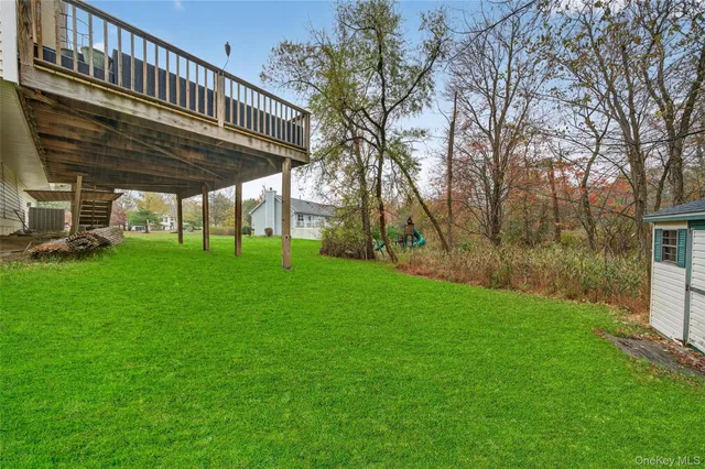 a view of a back yard with green space