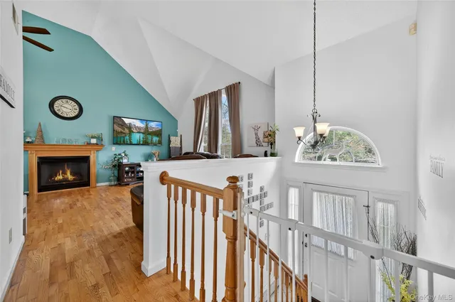 a view of an entryway with fireplace and workspace