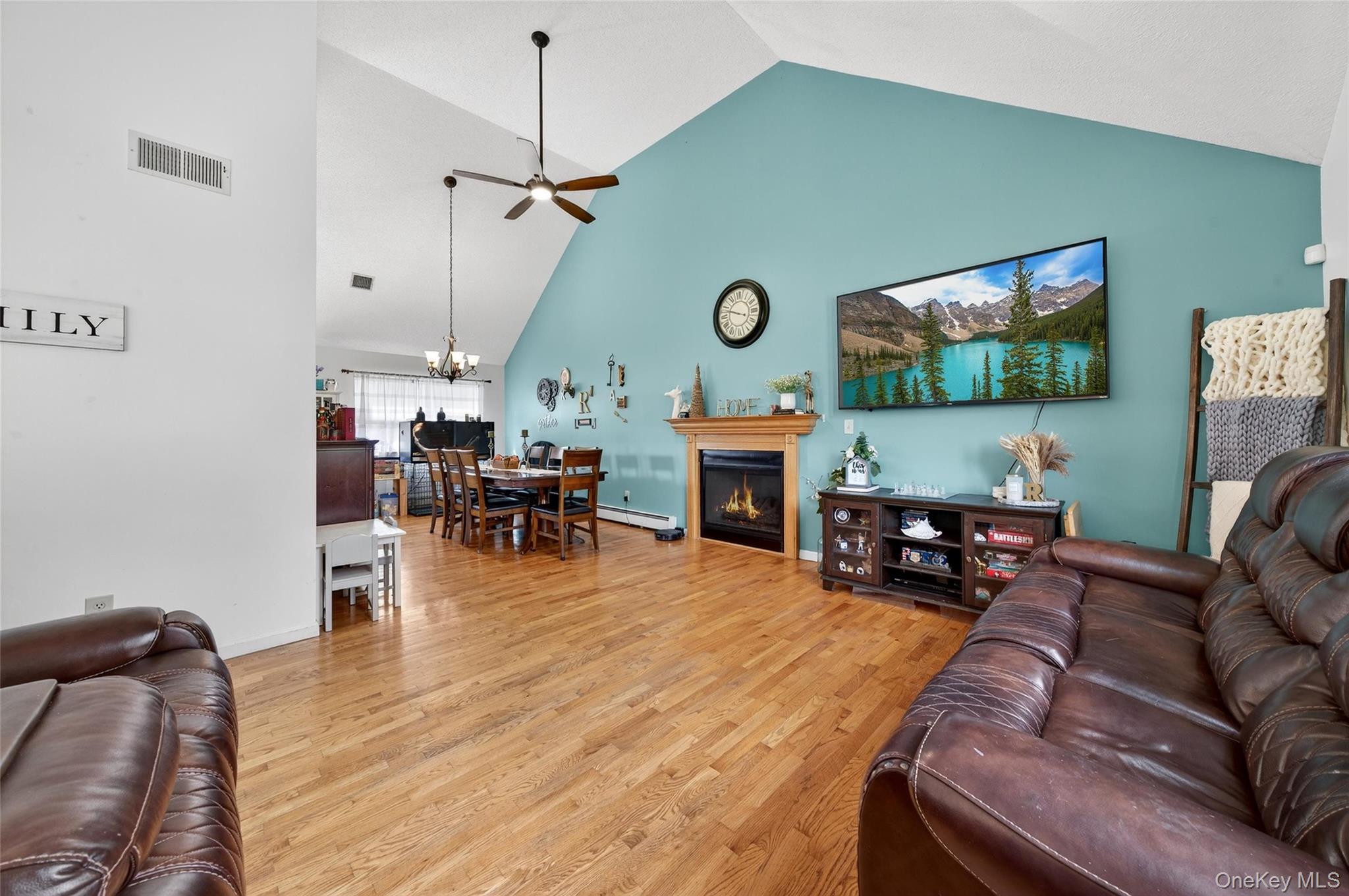 2 Berkeley Court Highland Mills, NY 10930 - Photo 10 of 44 a living room with fireplace furniture and a flat screen tv