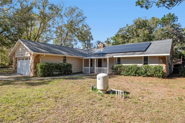 a house with trees in front of it