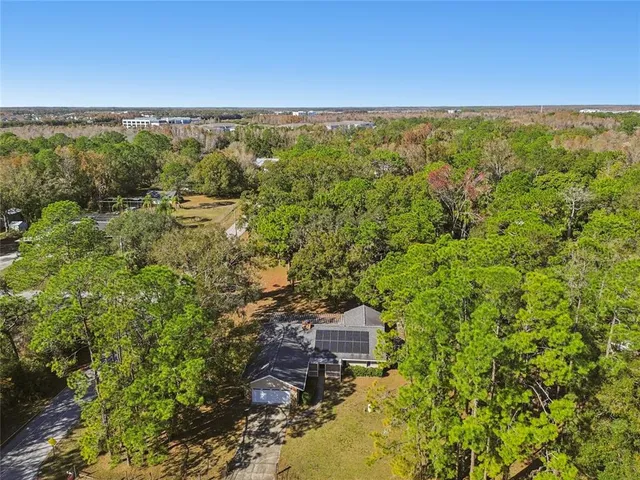 a view of a backyard with sitting area