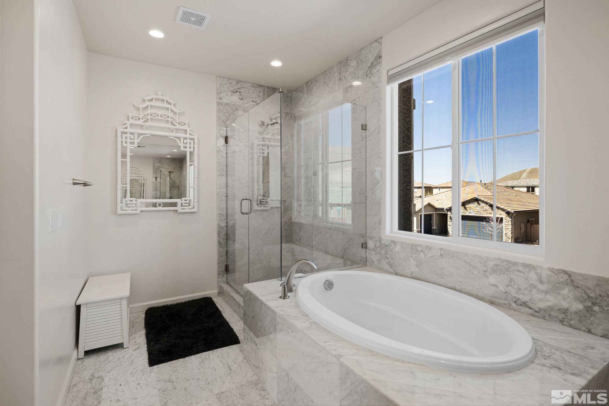 2900 Ethelinda Way Reno, NV 89521 - Photo 26 of 40 a bathroom with a tub sink and mirror