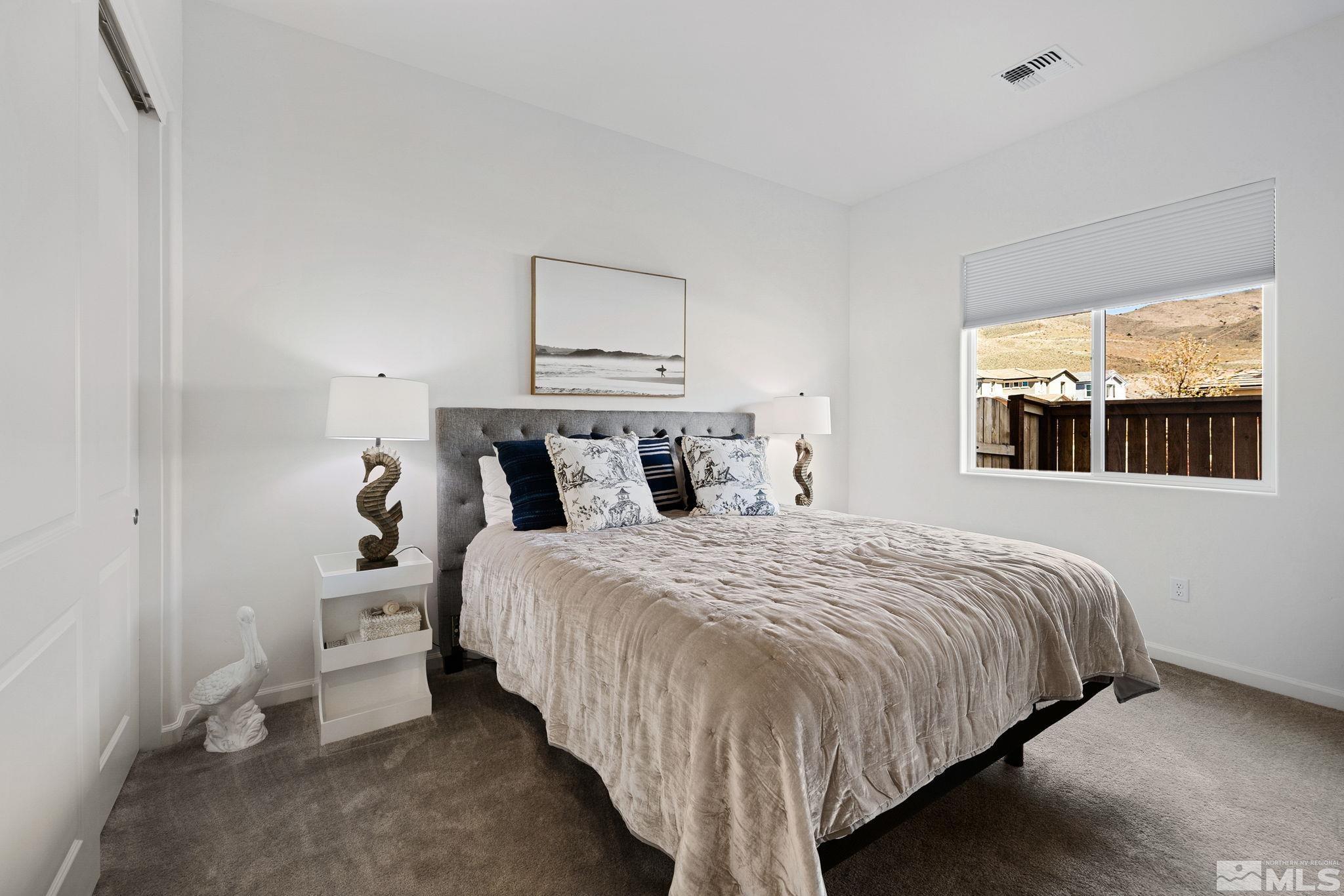 2900 Ethelinda Way Reno, NV 89521 - Photo 3 of 40 a bedroom with a bed and window