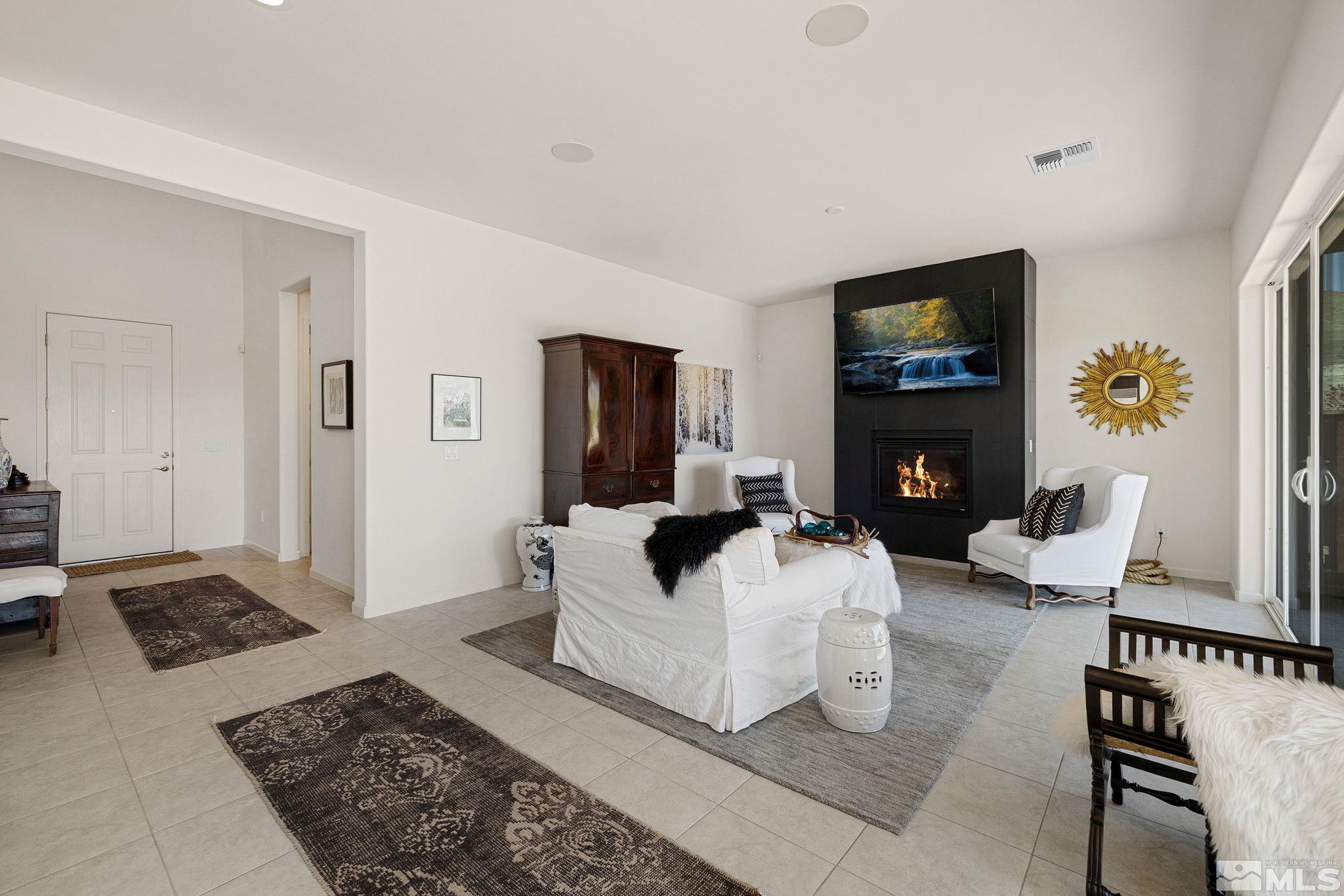 2900 Ethelinda Way Reno, NV 89521 - Photo 6 of 40 a living room with furniture and a fireplace