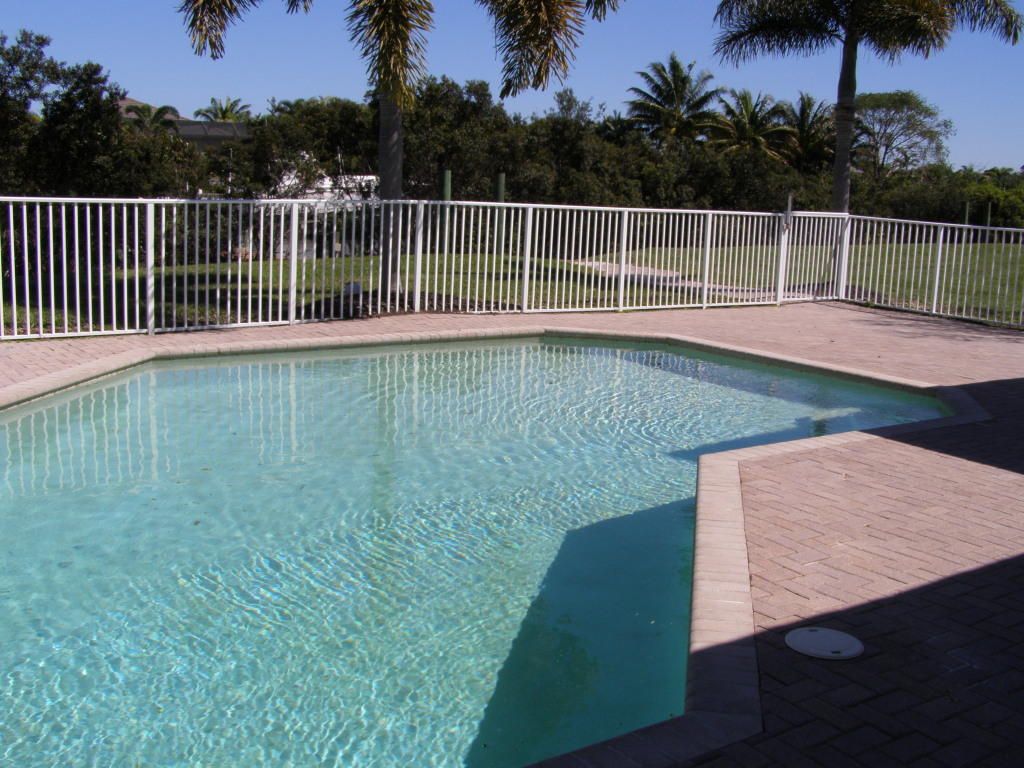 723 Southwest River Bend Circle Stuart, FL 34997 - Photo 3 of 39 tropical backyard