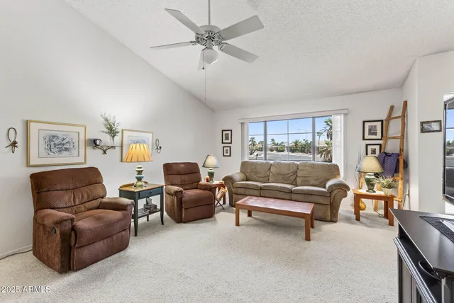 a living room with furniture and a window