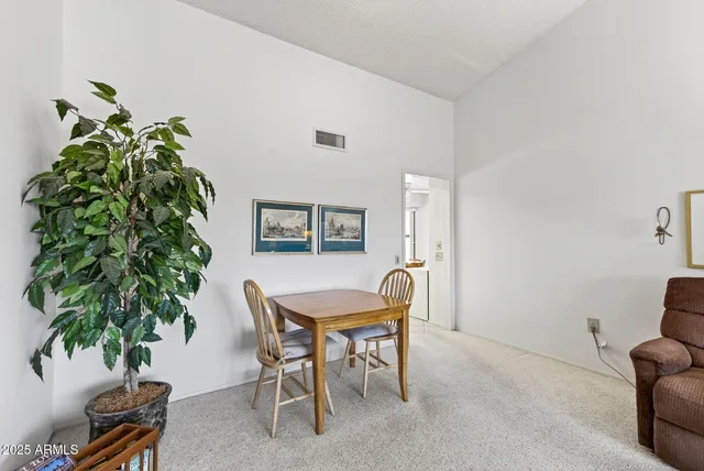 a living room with furniture plant and a potted plant