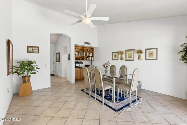 a dining room with furniture and window