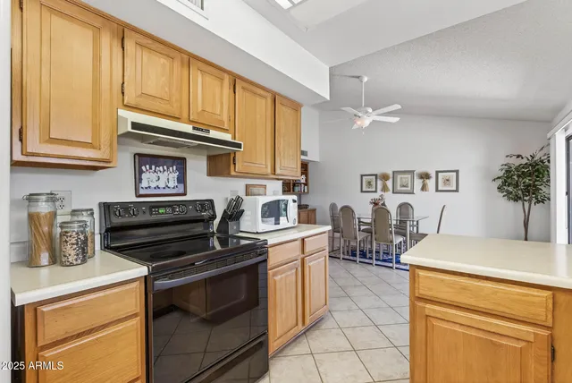 a kitchen with a stove and a sink