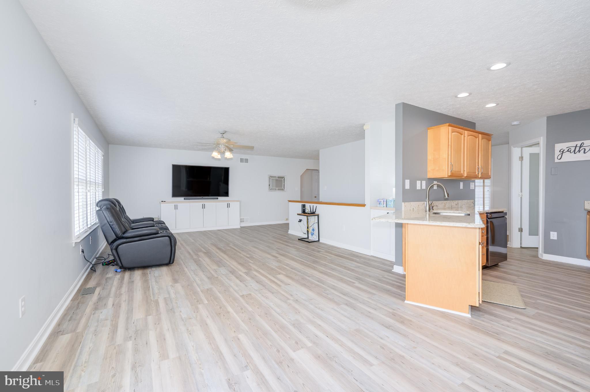 490 Renaissance Drive Martinsburg, WV 25403 - Photo 12 of 73 a living room with furniture and a flat screen tv