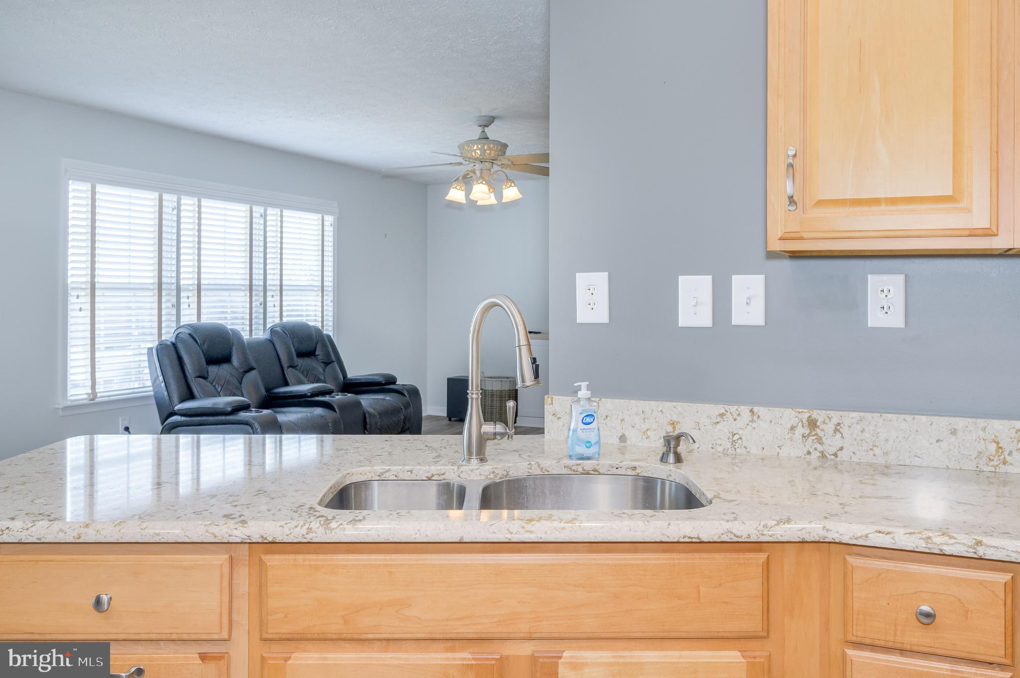 490 Renaissance Drive Martinsburg, WV 25403 - Photo 13 of 73 a kitchen with granite countertop a sink a window and stainless steel appliances