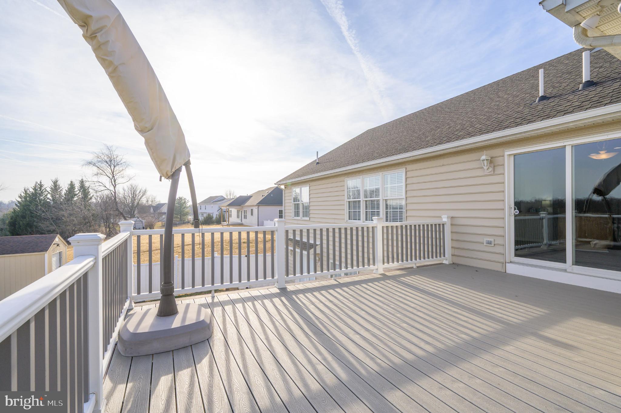 490 Renaissance Drive Martinsburg, WV 25403 - Photo 17 of 73 a view of a wooden deck with a yard