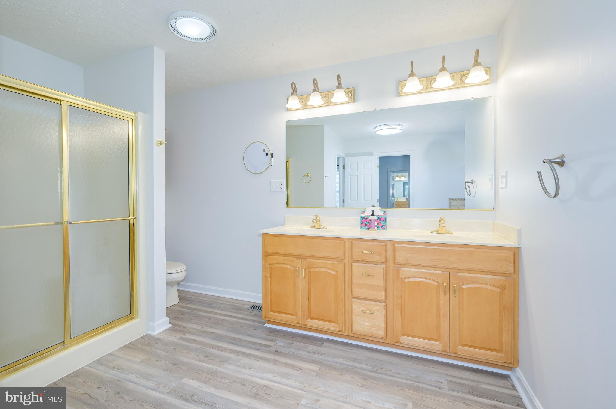 490 Renaissance Drive Martinsburg, WV 25403 - Photo 21 of 73 a spacious bathroom with a double vanity sink mirror and toilet