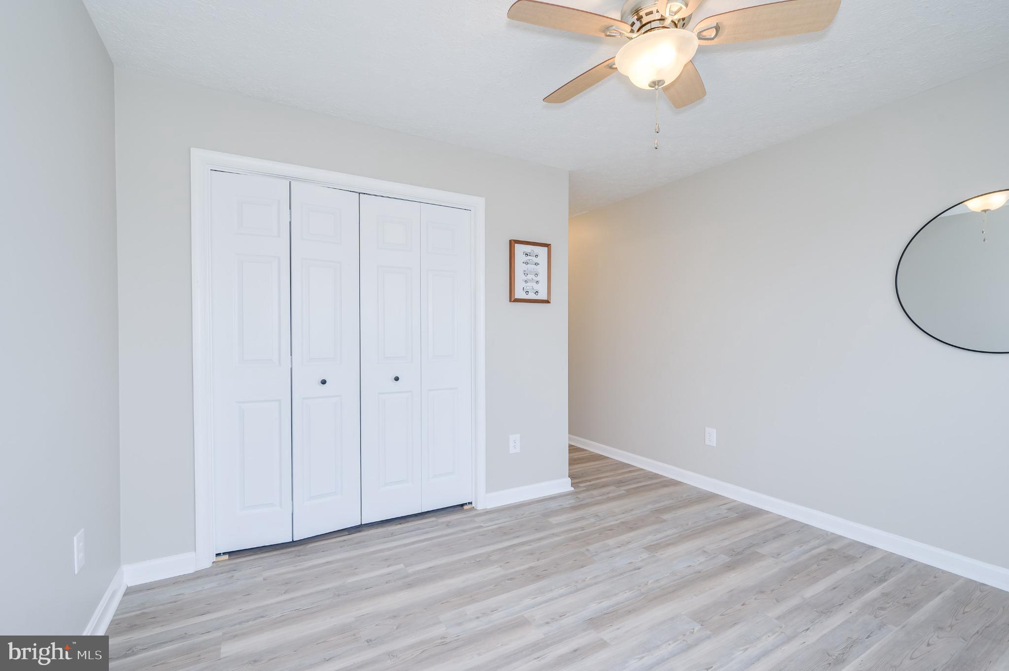 490 Renaissance Drive Martinsburg, WV 25403 - Photo 27 of 73 wooden floor in an empty room with a window