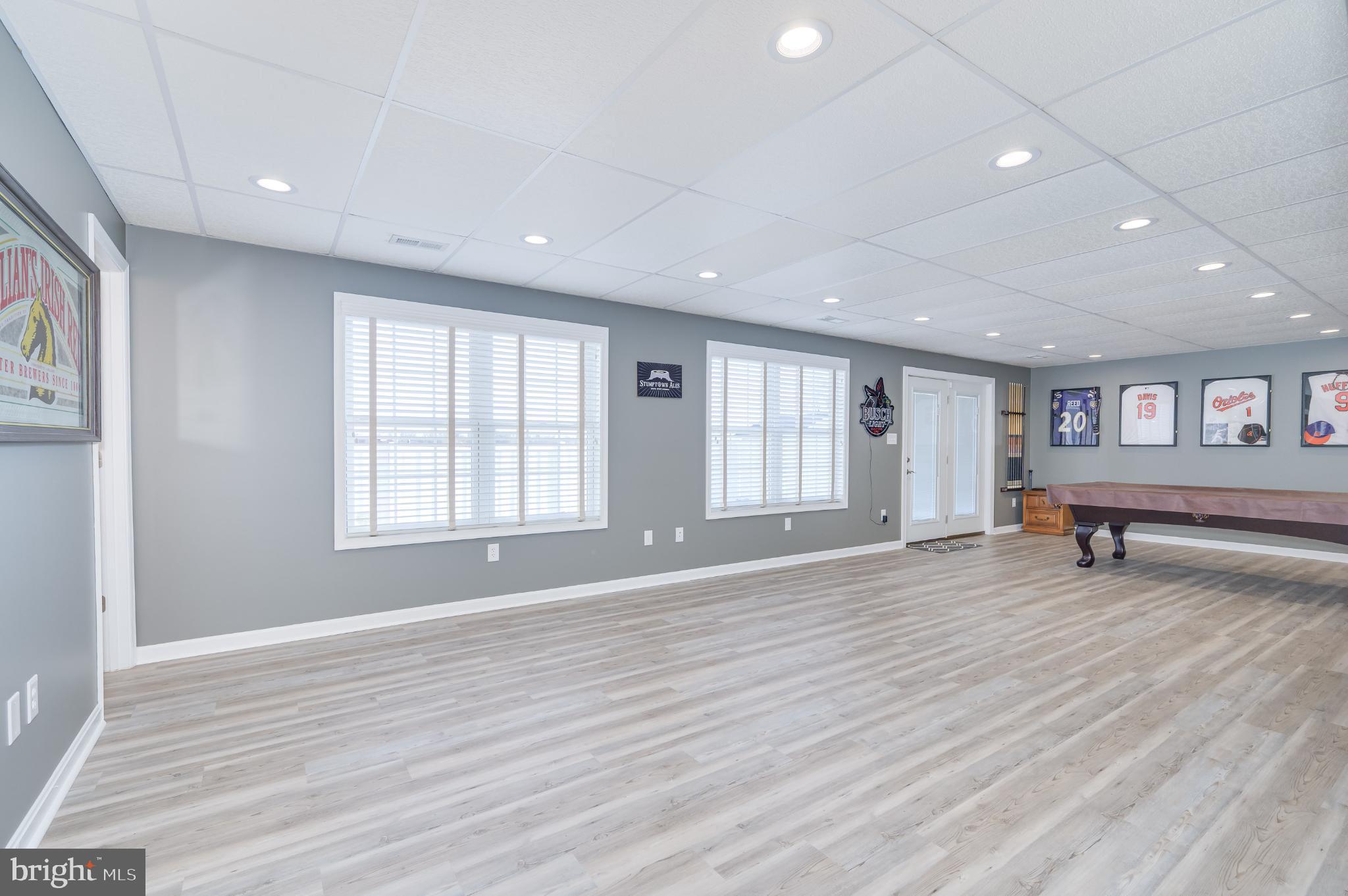 490 Renaissance Drive Martinsburg, WV 25403 - Photo 32 of 73 a view of an empty room with wooden floor and a window