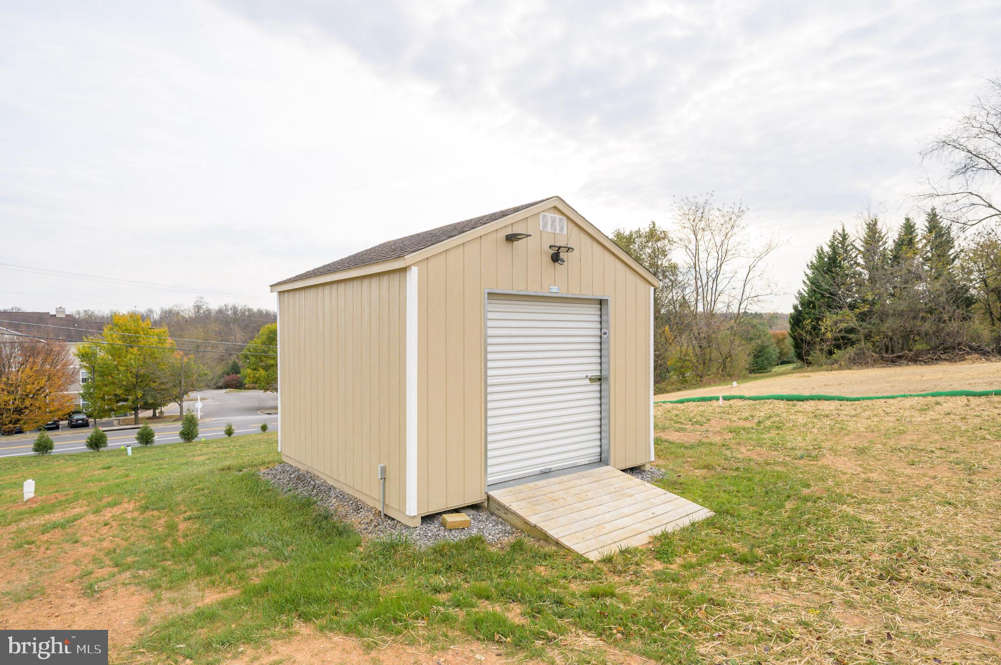 490 Renaissance Drive Martinsburg, WV 25403 - Photo 49 of 73 a view of a house with backyard and trees