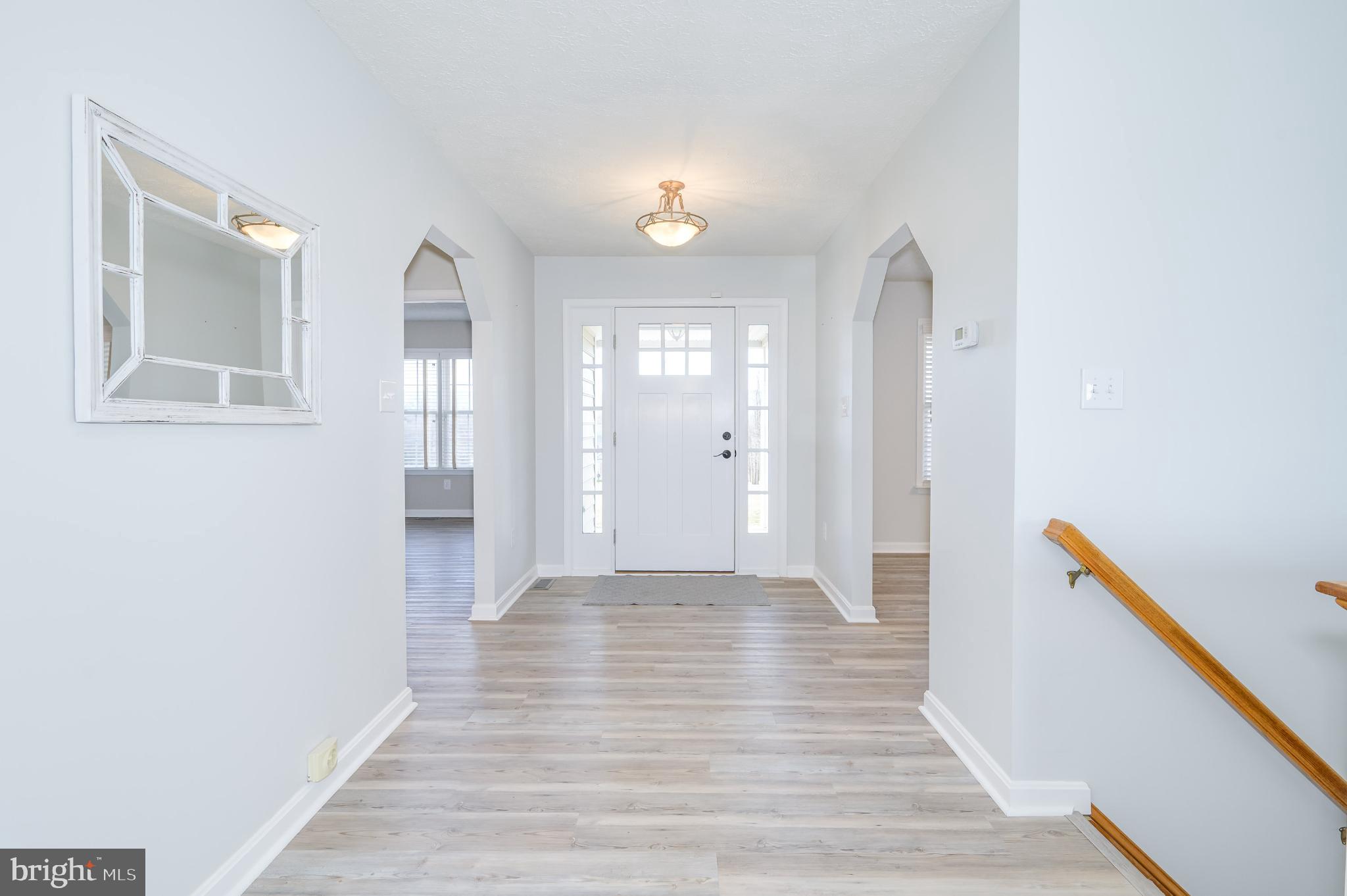 490 Renaissance Drive Martinsburg, WV 25403 - Photo 4 of 73 a view of a hallway with wooden floor