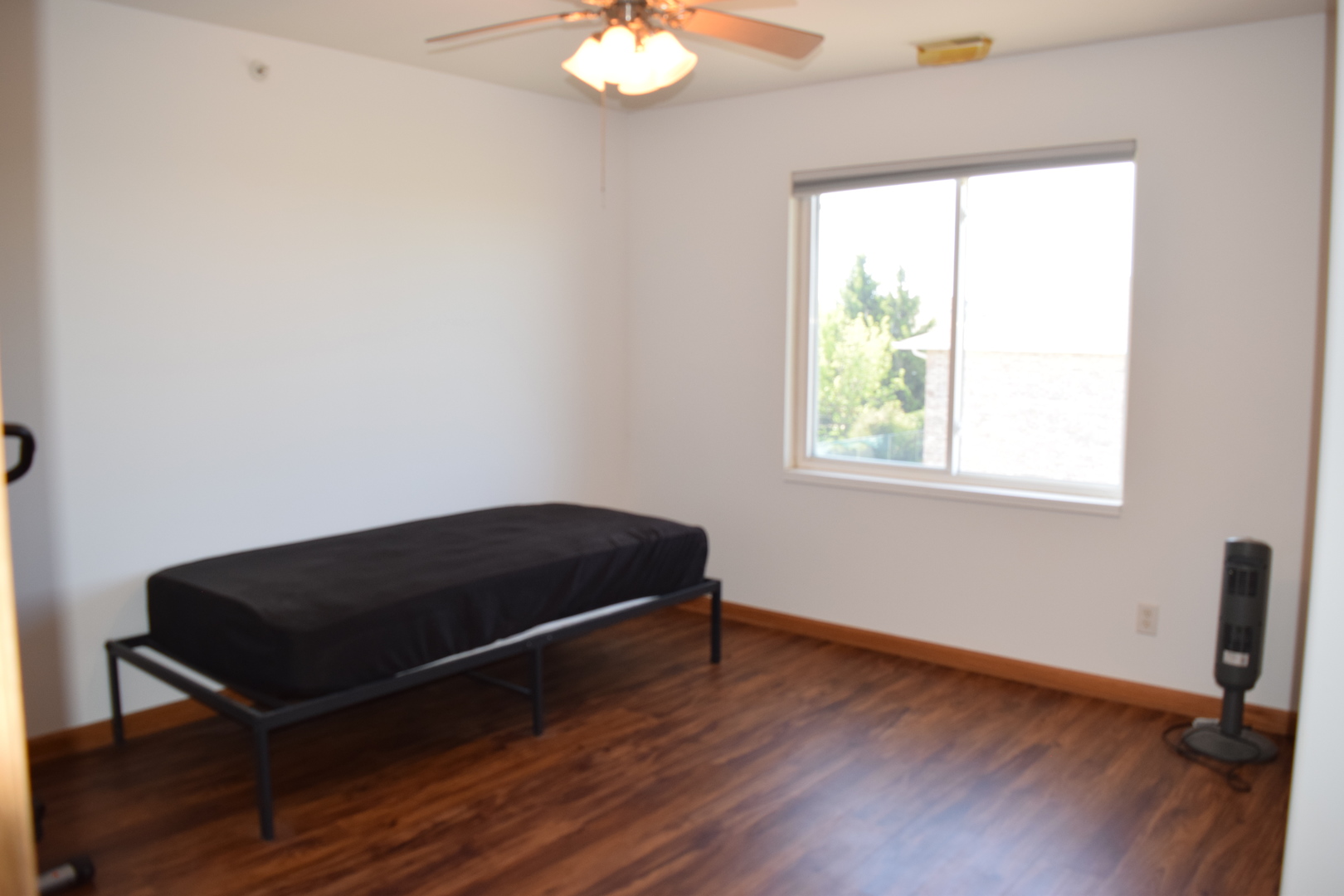 565 North Strack Street, Unit 302 Cortland, IL 60112 - Photo 12 of 15 a room with a bed and a window