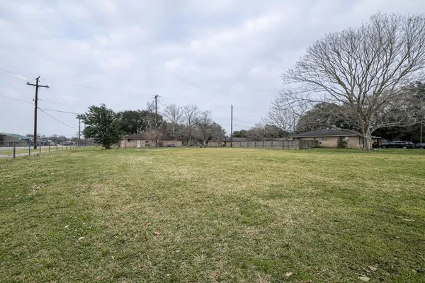 a view of a field with an ocean