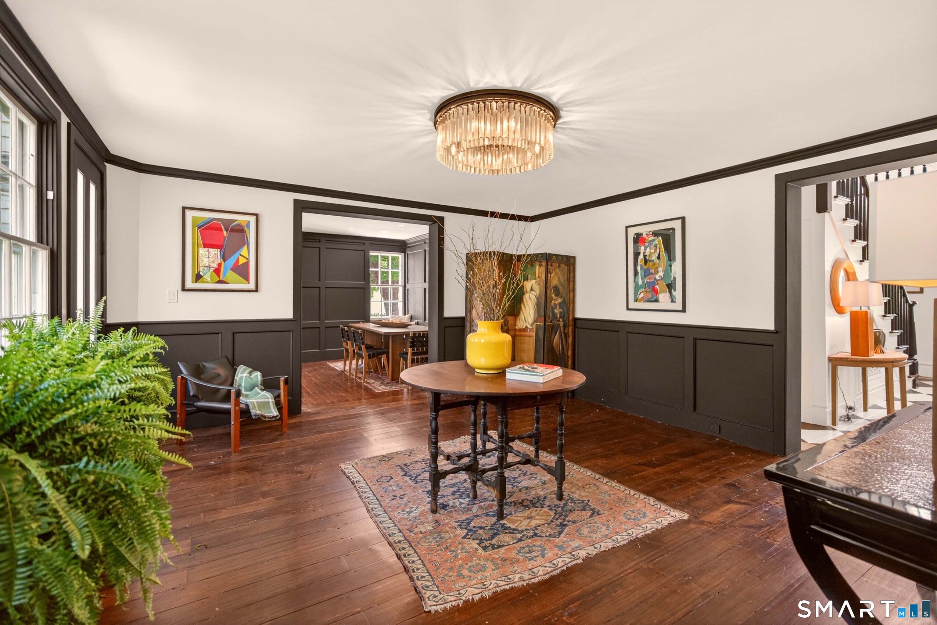 100 North Main Street Kent, CT 06757 - Photo 16 of 40 a living room with furniture a table and paintings on the wall