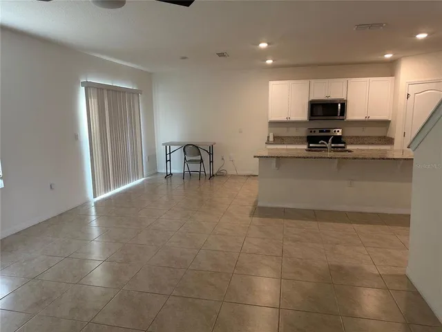 a view of a livingroom with a staircase
