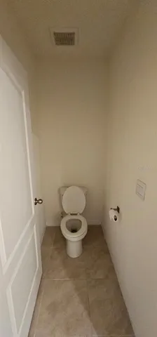 a bathroom with a toilet and a bathtub