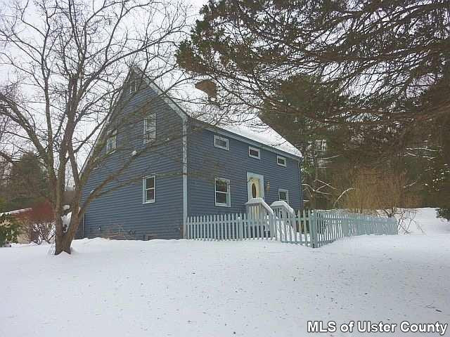 261 Bush Road Stone Ridge, NY 12484 - Photo 1 of 1 a house covered with snow in front of house