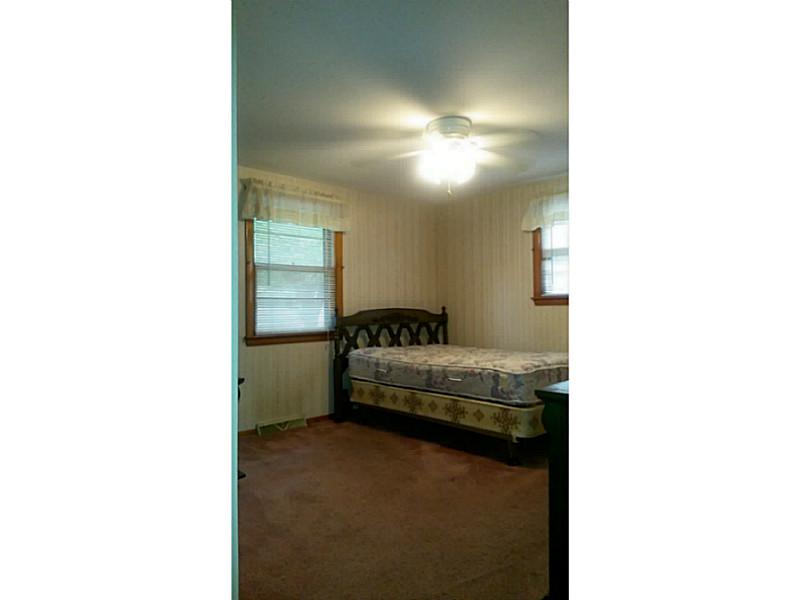 14 Lydia Road Coventry, RI 02816 - Photo 7 of 13 Bedroom. LARGE BEDROOM: ACTUALLY HARDWOODS UNDER THIS CARPET & CEILING FAN!