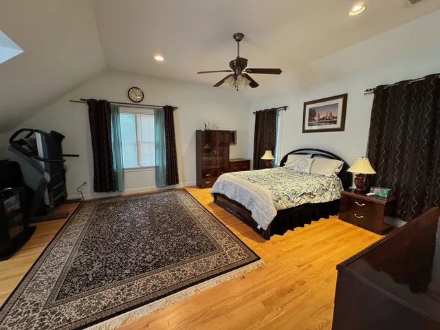 a bedroom with a bed and a dresser