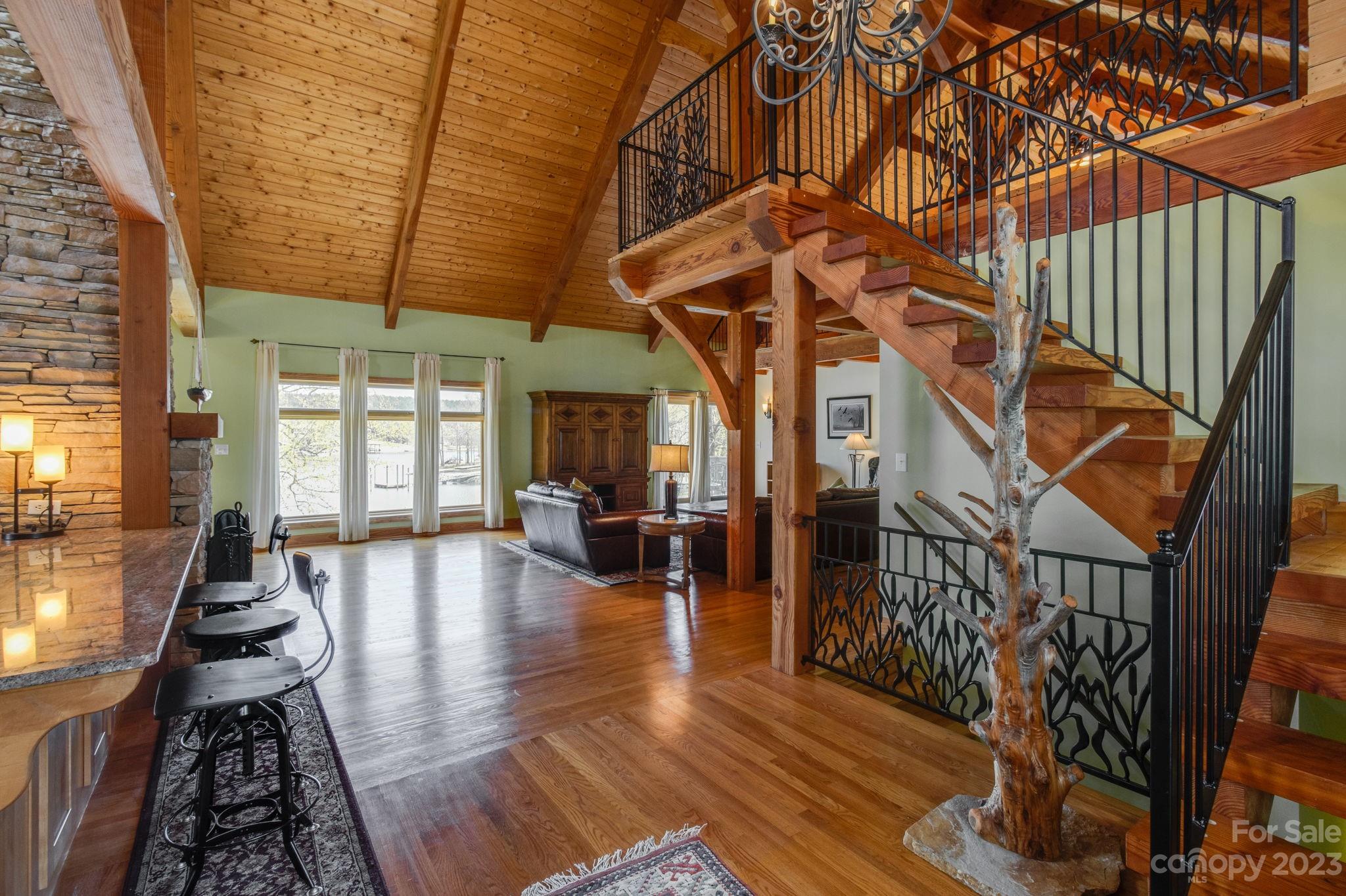 2709 Rolling Hills Road Ridgeway, SC 29130 - Photo 8 of 48 a view of dining room with wooden floor and large windows