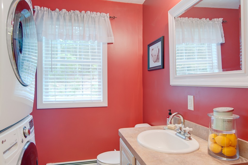 6 Vinton Road Sturbridge, MA 01566 - Photo 12 of 20 a bathroom with a sink a toilet and a mirror
