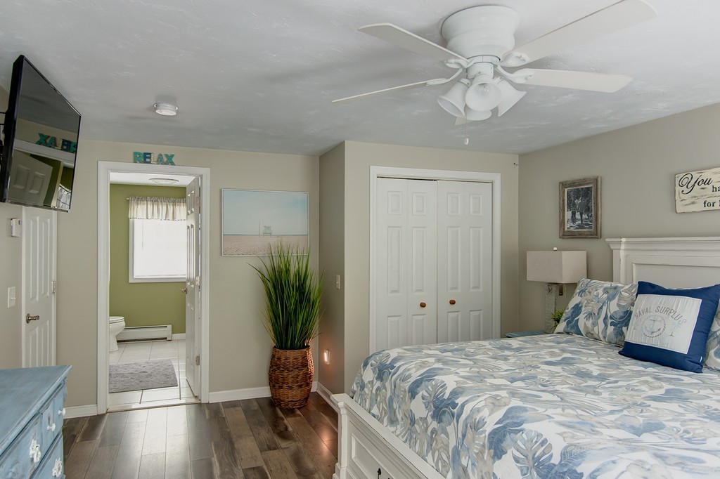 6 Vinton Road Sturbridge, MA 01566 - Photo 14 of 20 a bedroom with a bed and a potted plant