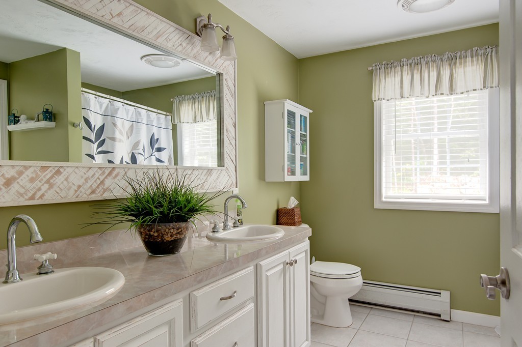 6 Vinton Road Sturbridge, MA 01566 - Photo 15 of 20 a bathroom with a toilet sink and mirror