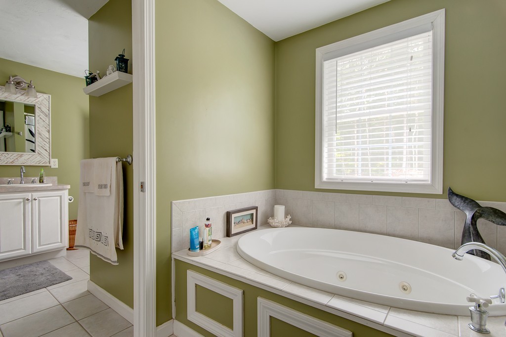 6 Vinton Road Sturbridge, MA 01566 - Photo 16 of 20 a bathroom with a tub sink and a window
