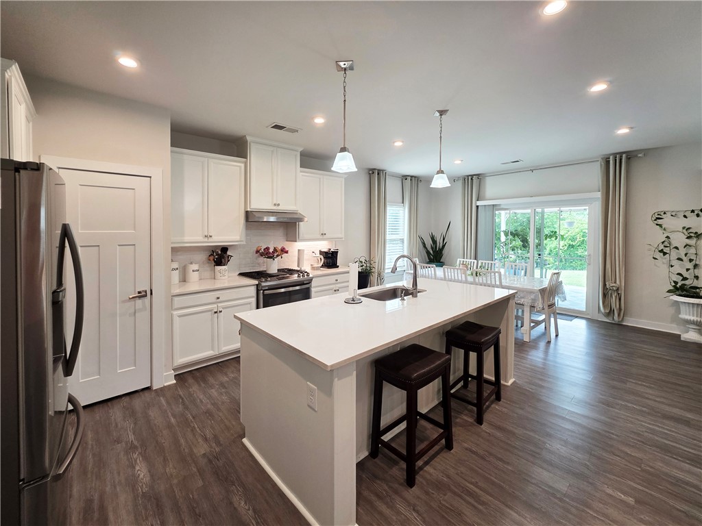 224 Bronson Ridge Anderson, SC 29621 - Photo 5 of 42 An inviting open-concept kitchen features a spacious island and effortless access to outdoor living.