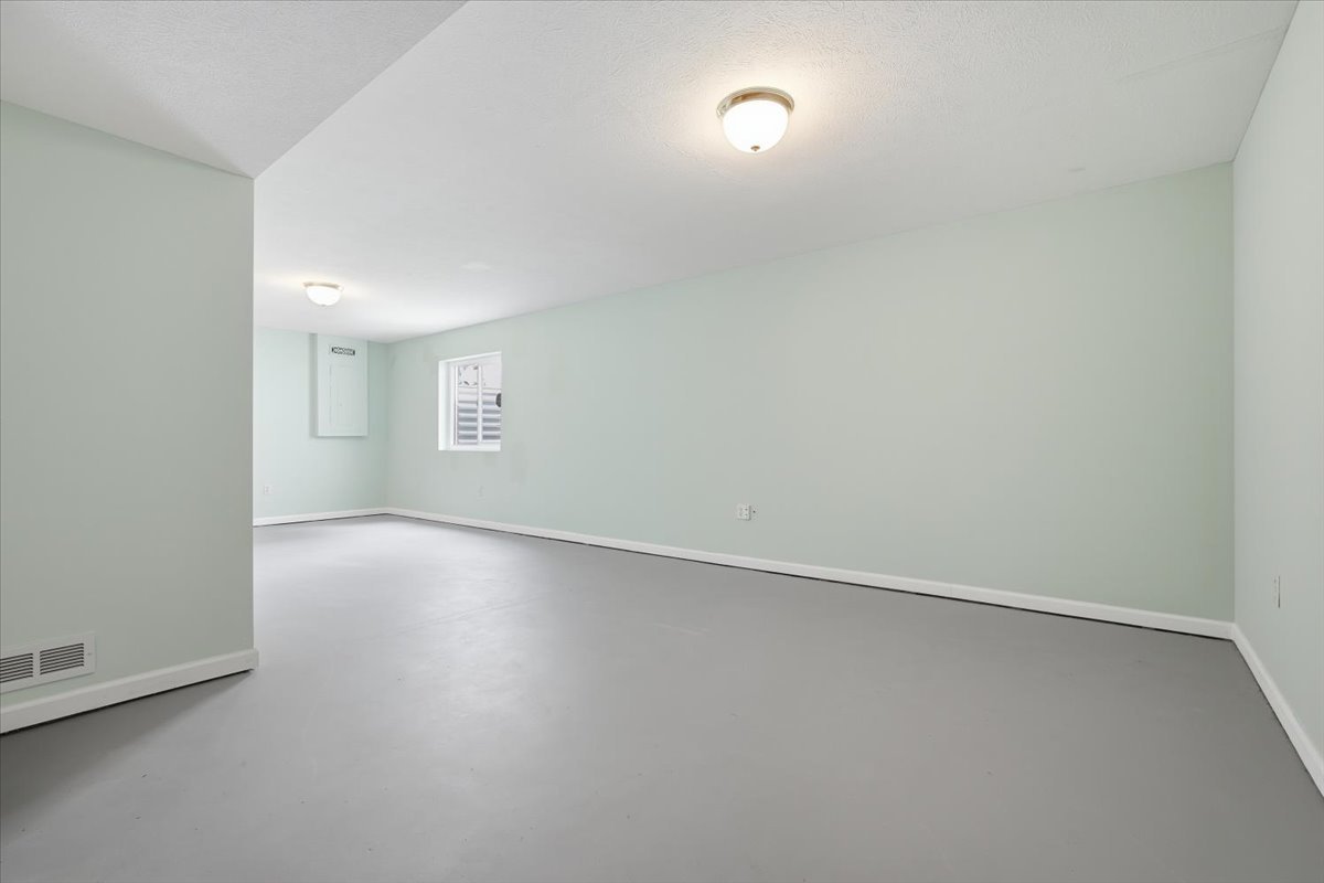 915 Teegan Street Normal, IL 61761 - Photo 26 of 33 an empty room with a empty space and windows