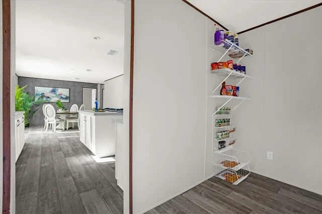 a view of entryway with workspace and wooden floor