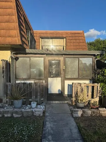 a front view of a building with glass windows
