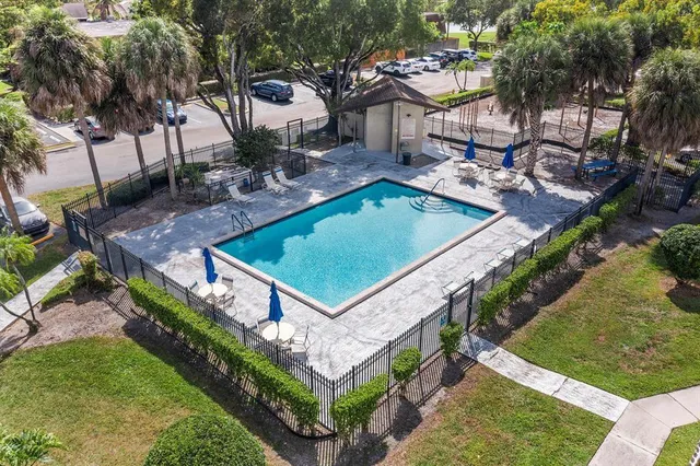 a view of a backyard with sitting area