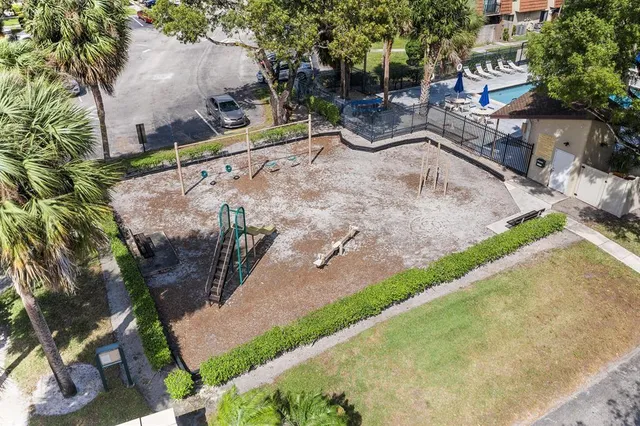 a view of a backyard with sitting area