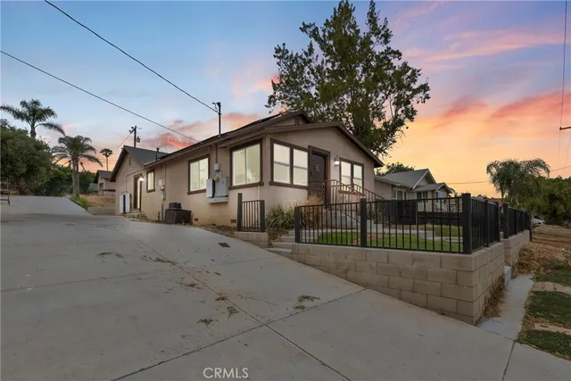 a front view of a house with a outdoor space