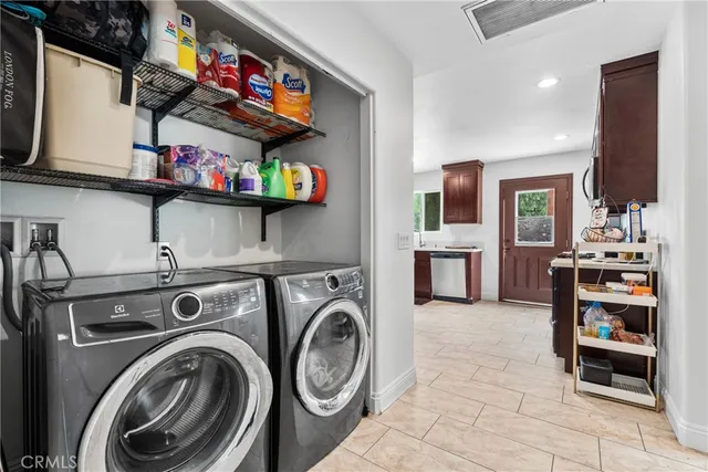 a view of livingroom with washer and dryer