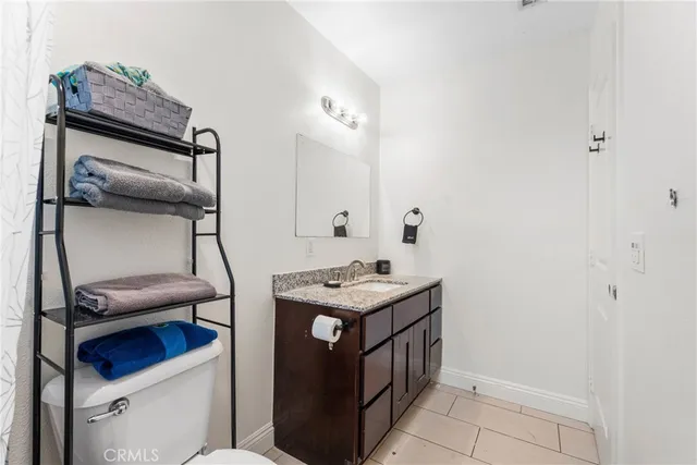 a bathroom with a sink a vanity and a mirror