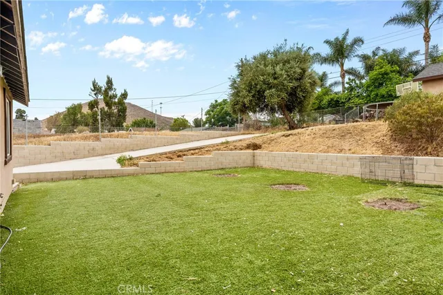 a view of a yard with an outdoor space and seating area